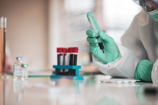 Doctor testing blood sample research vaccine