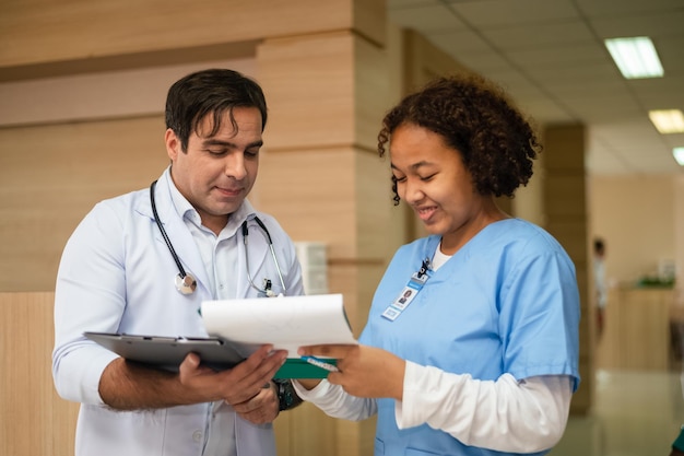 Doctor training nurse student at hospital