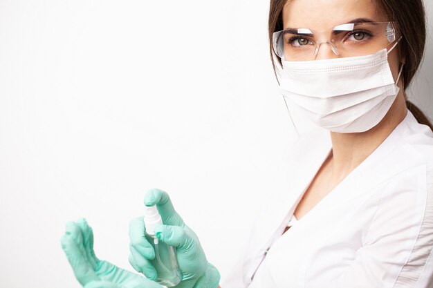 Doctor uses an antiseptic to disinfect the hands