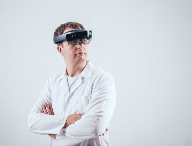 Doctor uses augmented reality goggles.