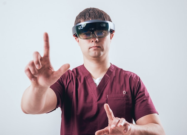 Doctor uses augmented reality goggles.