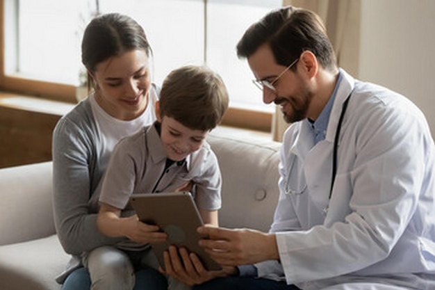 a doctor uses a tablet with his family