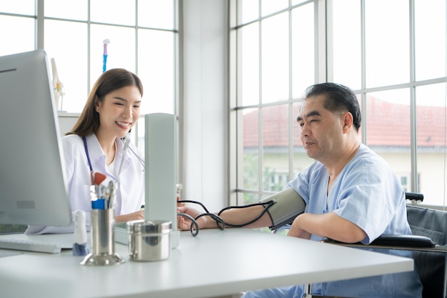 Doctor using a blood pressure monitor on a patient