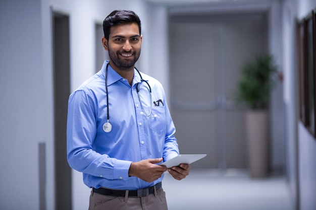 Doctor using digital tablet