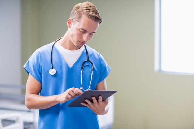 Doctor using digital tablet