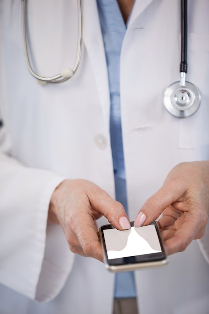 Doctor using mobile phone