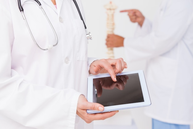 Doctor using tablet pc