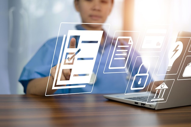 Doctor using technology document management on computer system management for cardiologist Specialist in treating heart disease for treatment in hospital DMS document management concept