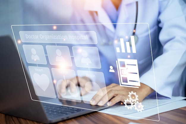 Doctor using technology document management on computer system management for cardiologist Specialist in treating heart disease for treatment in hospital DMS document management concept