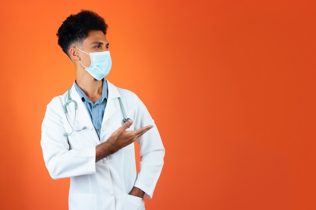 Doctor or Veterinarian Isolated Black Young Medical Resident With Stethoscope and Pandemic Mask