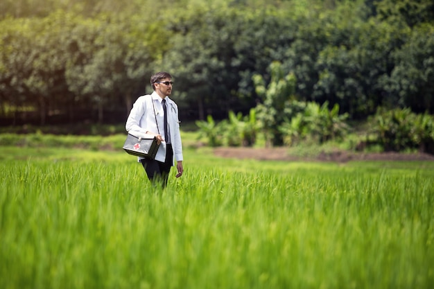 Doctor walks in the field, the concept of a physician who sacrifices himself to help the poor.