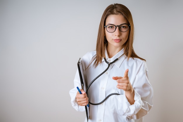 Doctor wearing glasses with phonendoscope around her neck