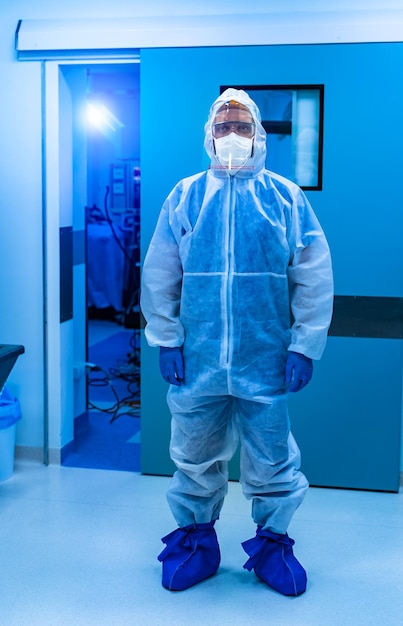 Doctor wearing protective suit to fight coronavirus pandemic covid2019 Protective suit goggles gloves respirator