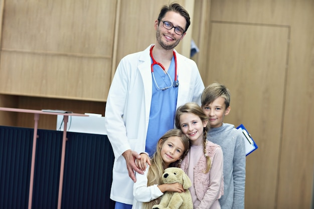 doctor welcoming children in clinic