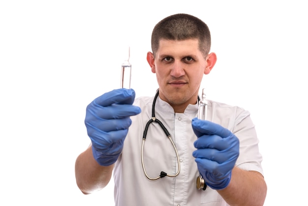 Doctor with ampoules. He's wearing medic uniform and having stethoscope around his neck