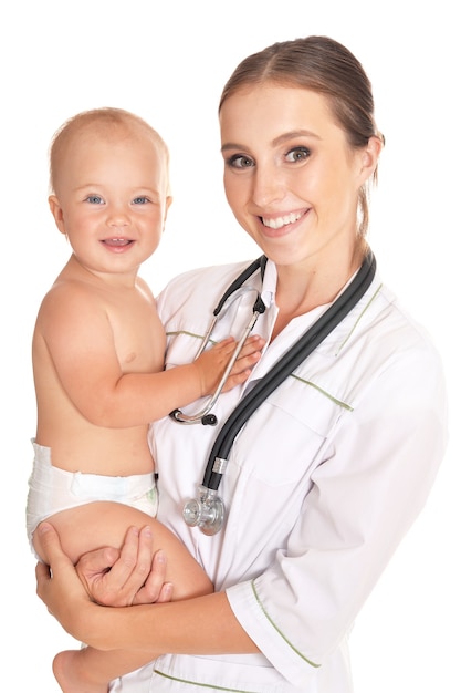 Doctor with child in hospital on a light background