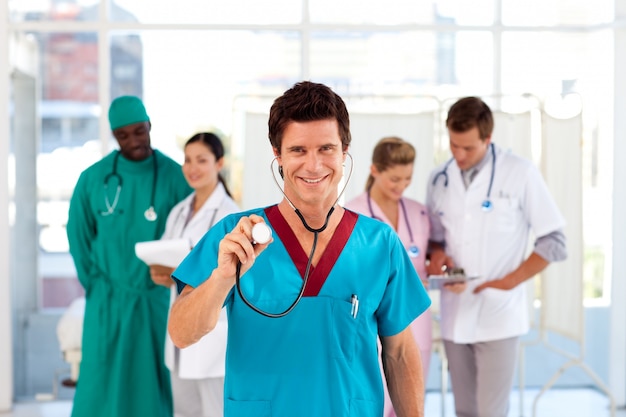 Doctor with colleagues in the background