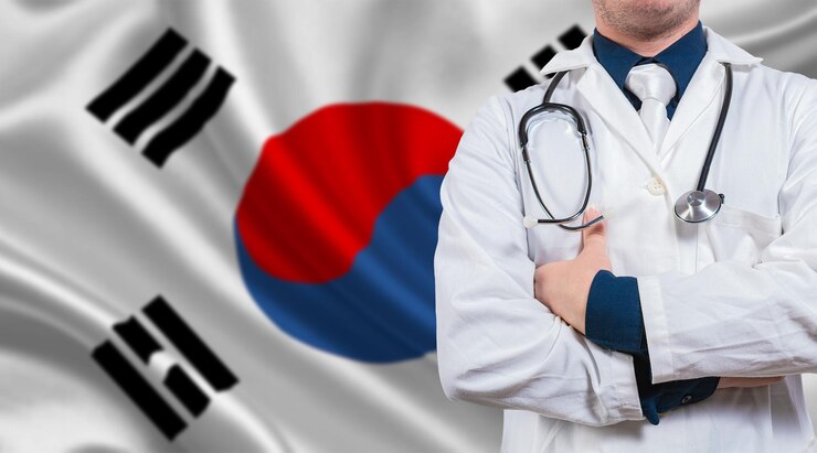 韓国の国旗に腕を組む医師 韓国の国旗に医療健康とケア 韓国の国旗に聴診器を持つ医師