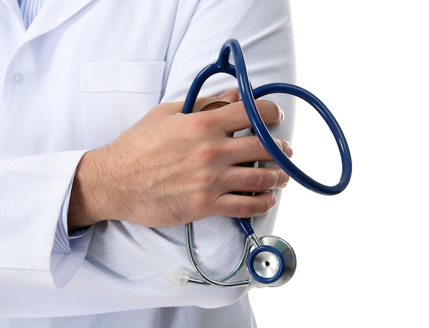 Doctor with crossed hands and stethoscope isolated on white background close up