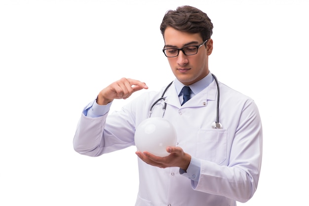 Doctor with crystal ball isolated on white