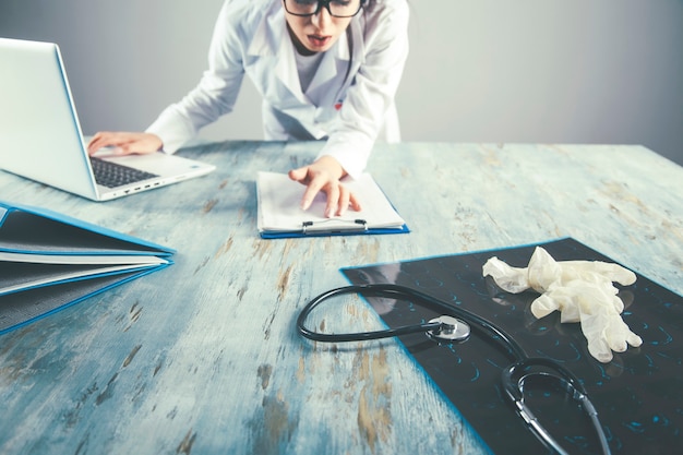 Doctor with Medical equipment on desk