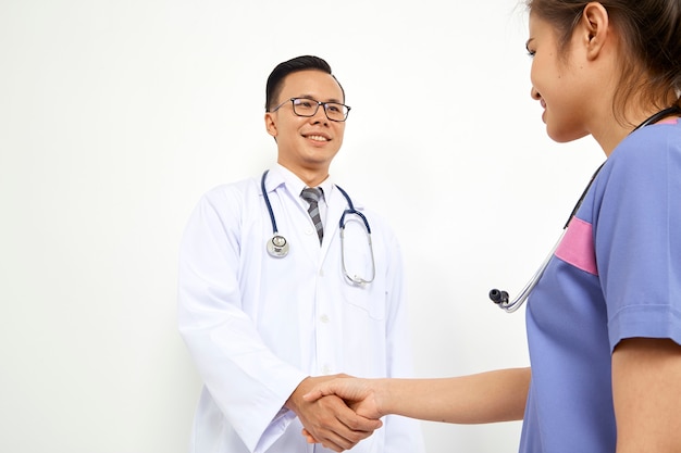 Doctor with nurse on white background