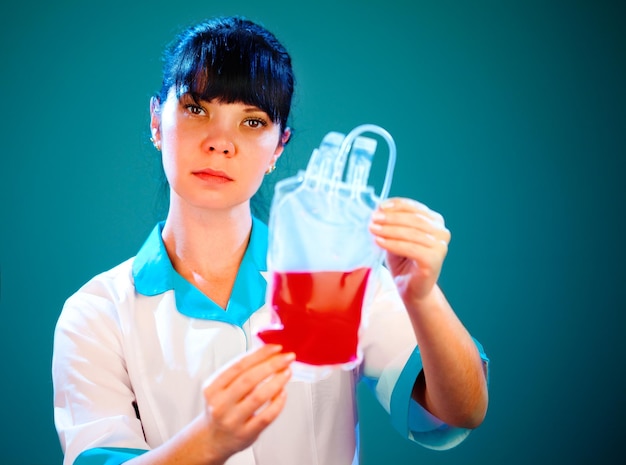 doctor with a package of donor blood