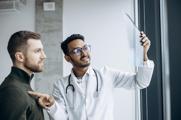 Doctor with patient looking at his xray