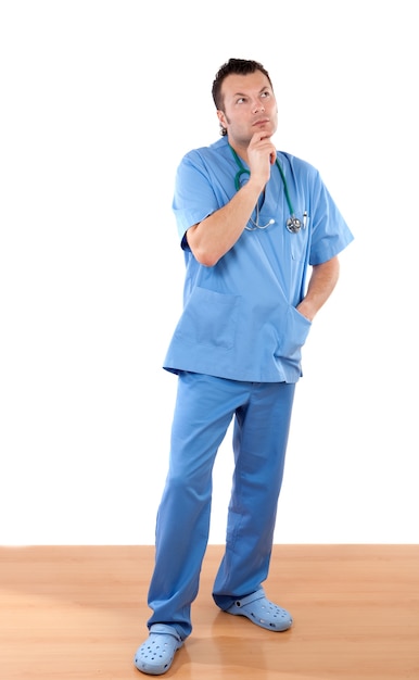 Doctor with pensive gesture isolated on white background