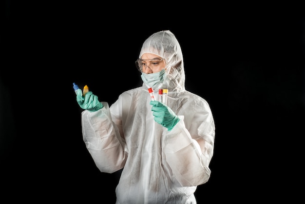 Doctor with protective suit and blood samples