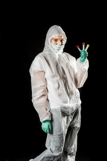 Doctor with protective suit and blood samples