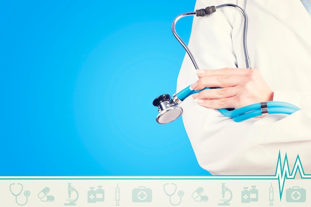 doctor with stethoscope on blue background