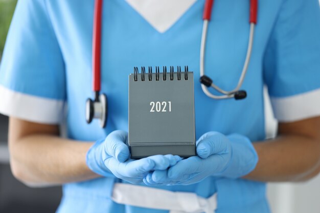 Doctor with a stethoscope and desk calendar