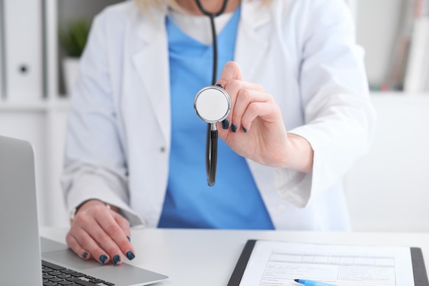 Doctor with a stethoscope in the hands.