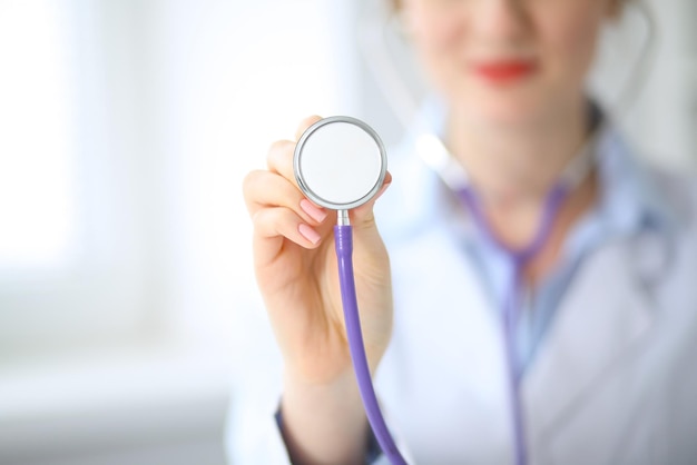 Doctor with a stethoscope in the hands.