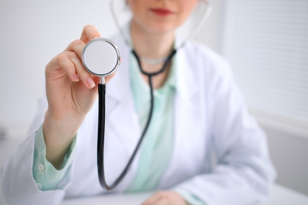 Doctor with a stethoscope in the hands.