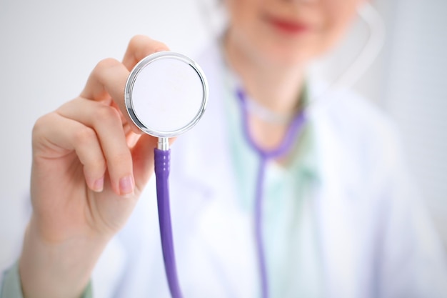 Doctor with a stethoscope in the hands.