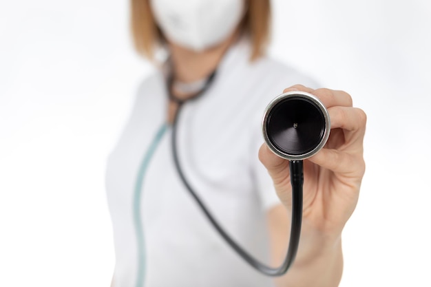 Doctor with stethoscope in her hands