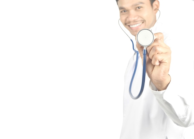 Doctor with stethoscope standing on white background