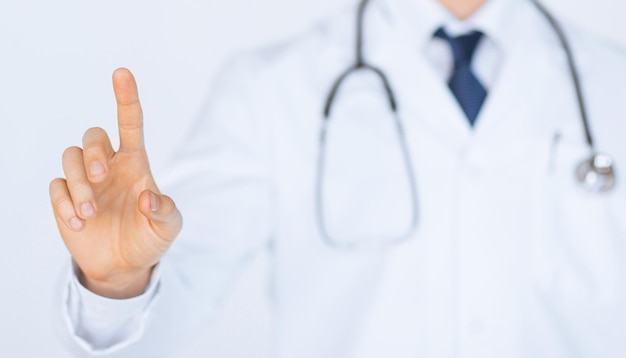 doctor with stethoscope working with virtual screen