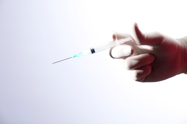 Photo doctor with syringe for coronavirus vaccine injection