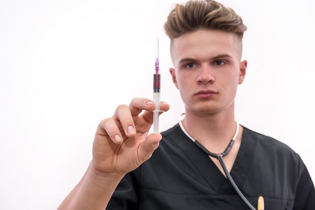 doctor with syringe young doctor in medic uniform holding syringe in hand  isolated on white