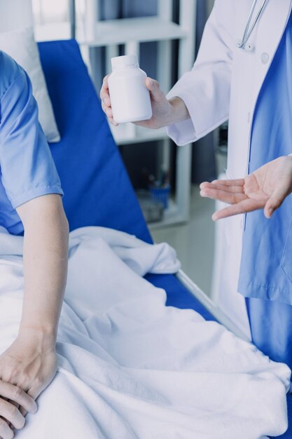 Doctor woman consulting patient sitting at doctor office prevention of men diseases healthcare medical service consultation concept