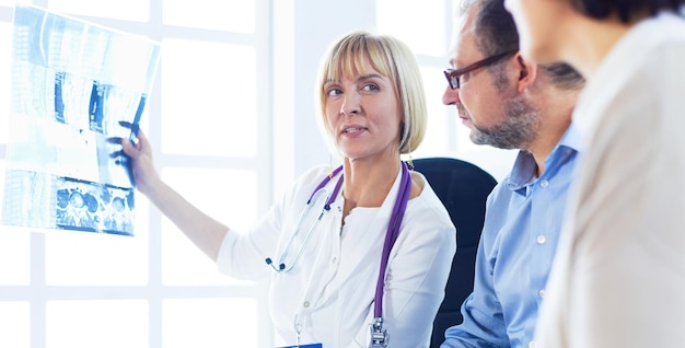 Doctor woman explaining xray results to patient