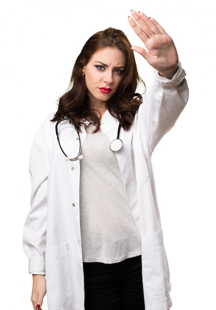 Doctor woman making stop sign