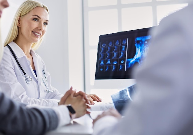 Doctor woman shows the patient chest xray