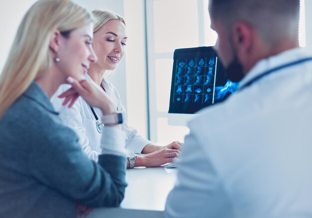 Doctor woman shows the patient chest xray