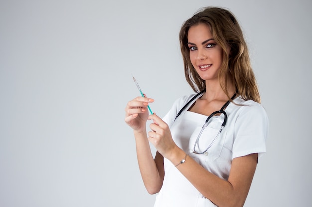 Photo doctor woman with syringe isolated on white , nurse with needle