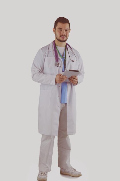 Photo doctor working on a digital tablet on white background