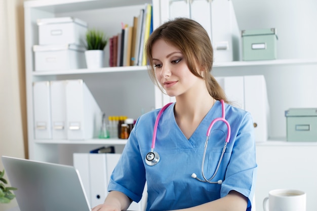 Doctor working at her office